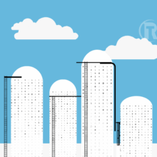 Binary data silos against a blue sky background