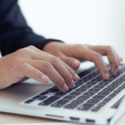Male typing on keyboard