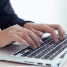 Male typing on keyboard