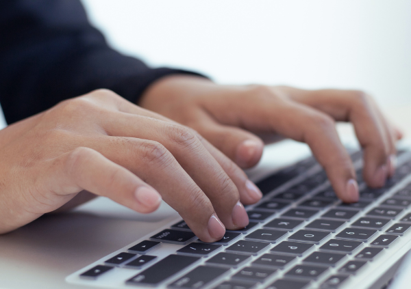 Male typing on keyboard